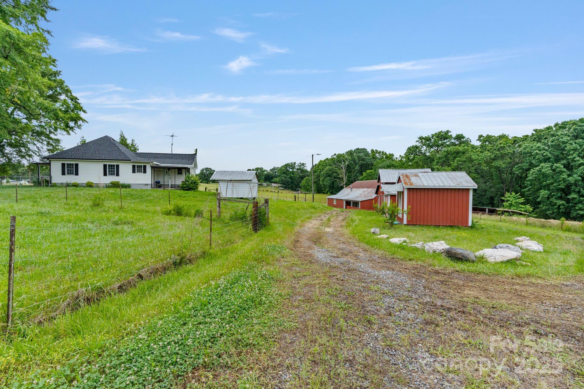 956 Stoney Point Road Kings Mountain, NC 28086 - Photo 44 of 48 a view of a big house with a big yard and large trees