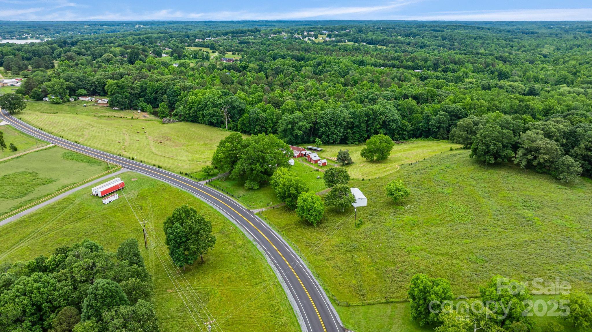 956 Stoney Point Road Kings Mountain, NC 28086 - Photo 46 of 48 a view of a lake with a yard