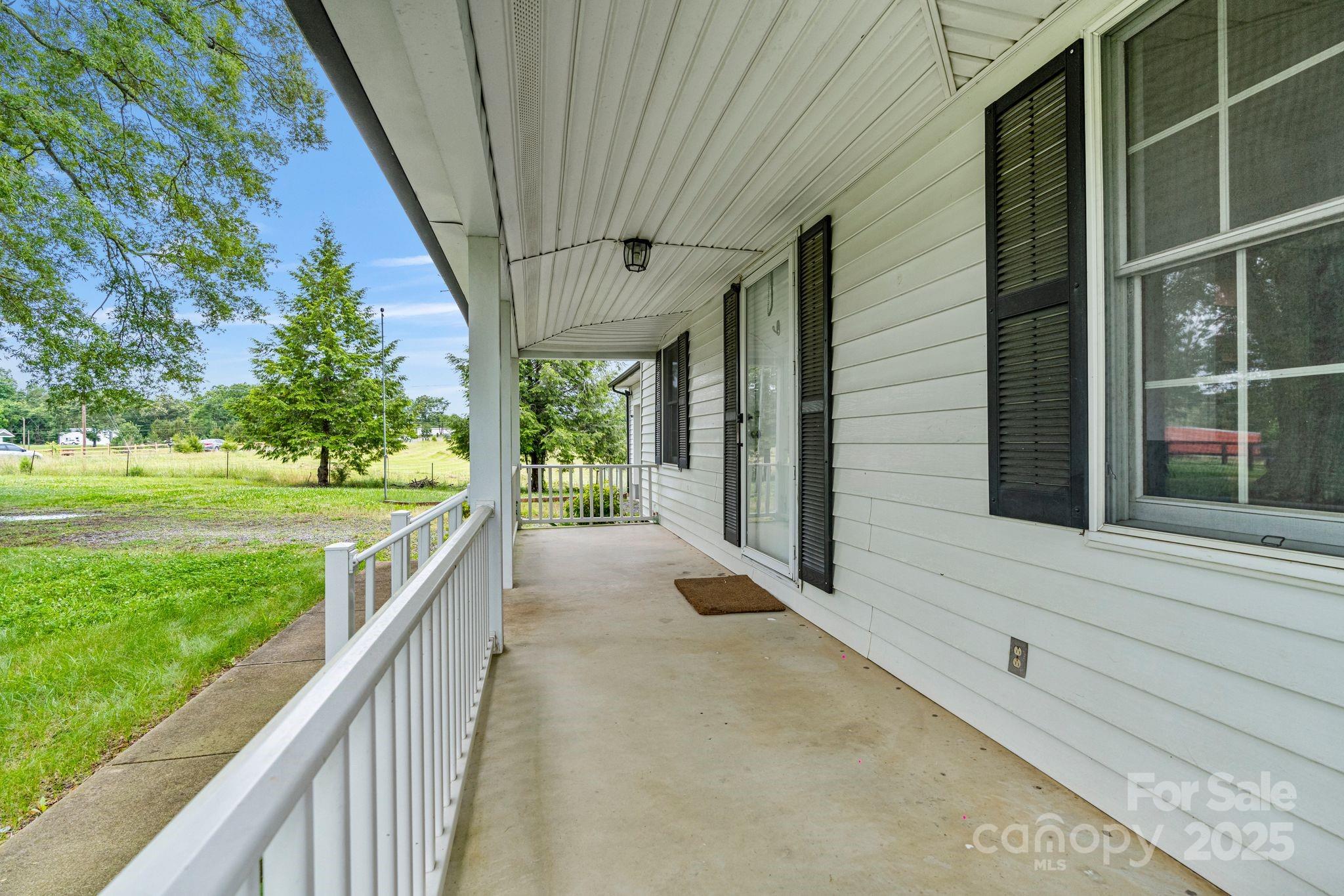 956 Stoney Point Road Kings Mountain, NC 28086 - Photo 7 of 48 a view of a porch with a yard