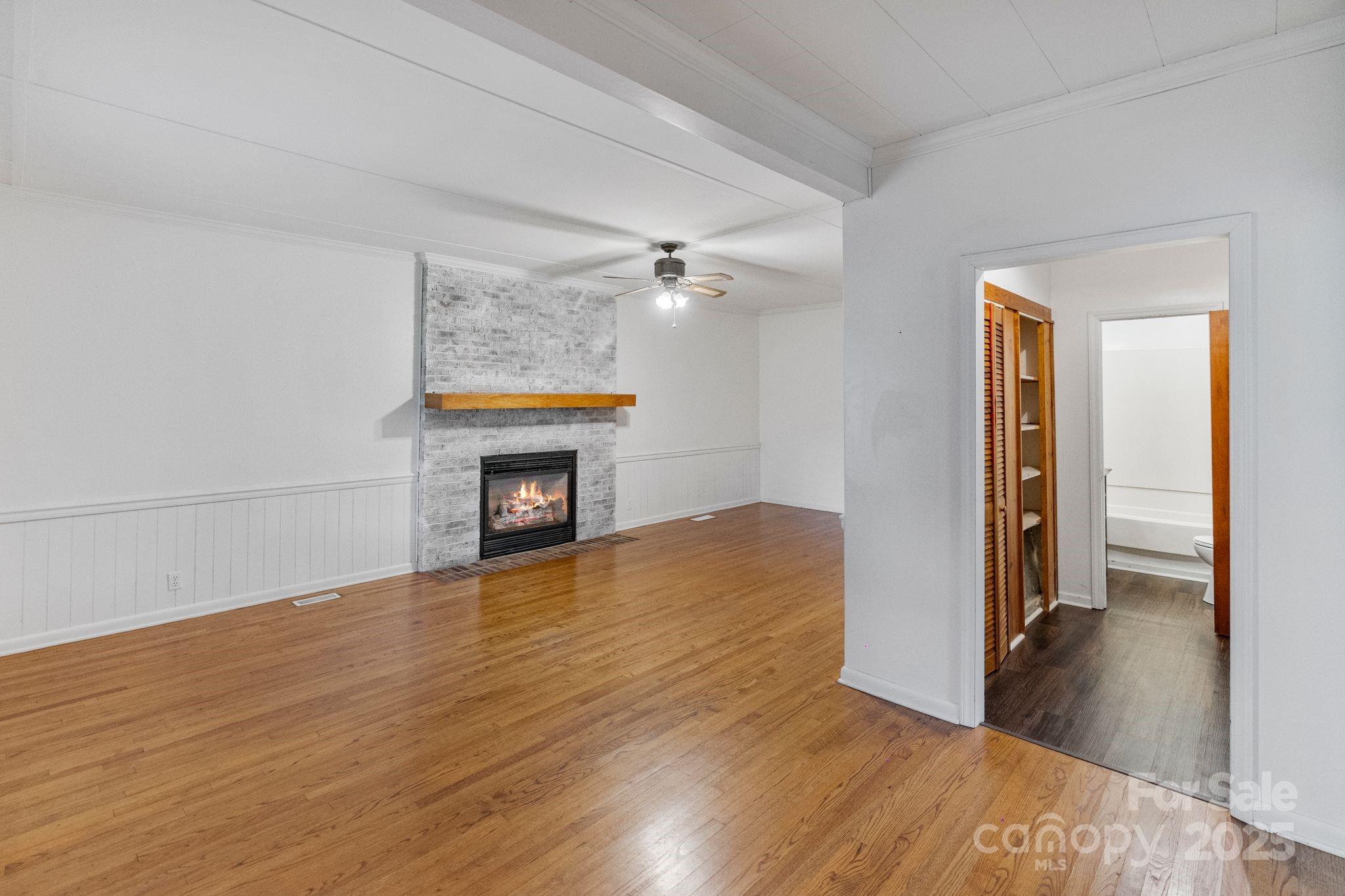 956 Stoney Point Road Kings Mountain, NC 28086 - Photo 8 of 48 a view of an empty room and wooden floor