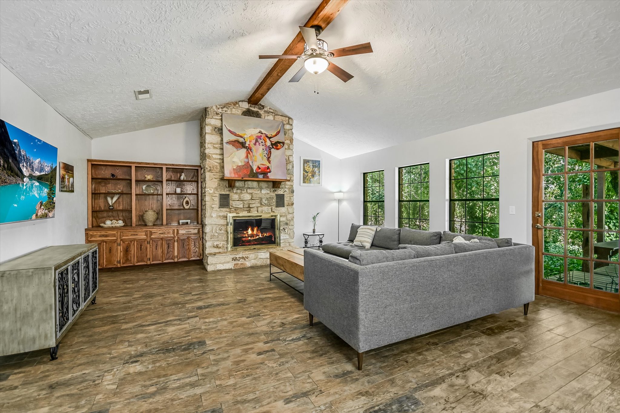 175 Fischer Trail Wimberley, TX 78676 - Photo 2 of 31 a living room with furniture and a fireplace