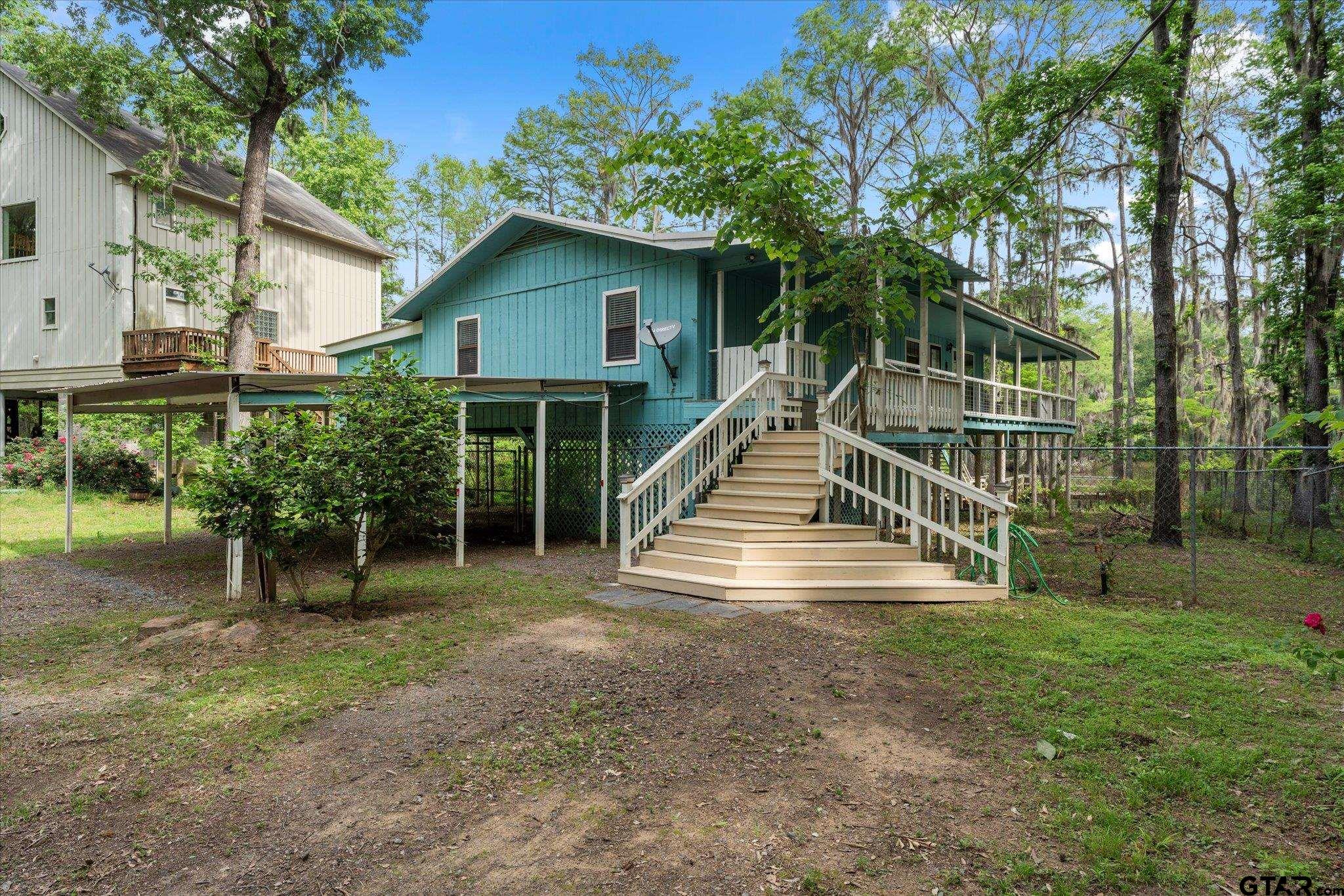 230 Sesame Street West Karnack, TX 75661 - Photo 12 of 44 a view of house with a yard