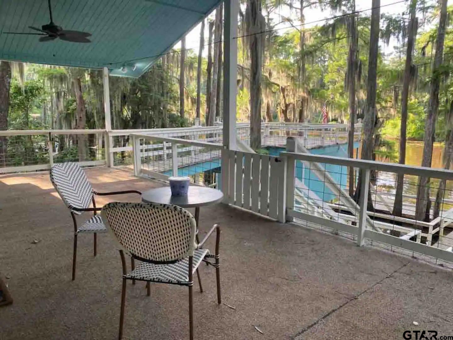 230 Sesame Street West Karnack, TX 75661 - Photo 16 of 44 a view of a chairs and table in the patio