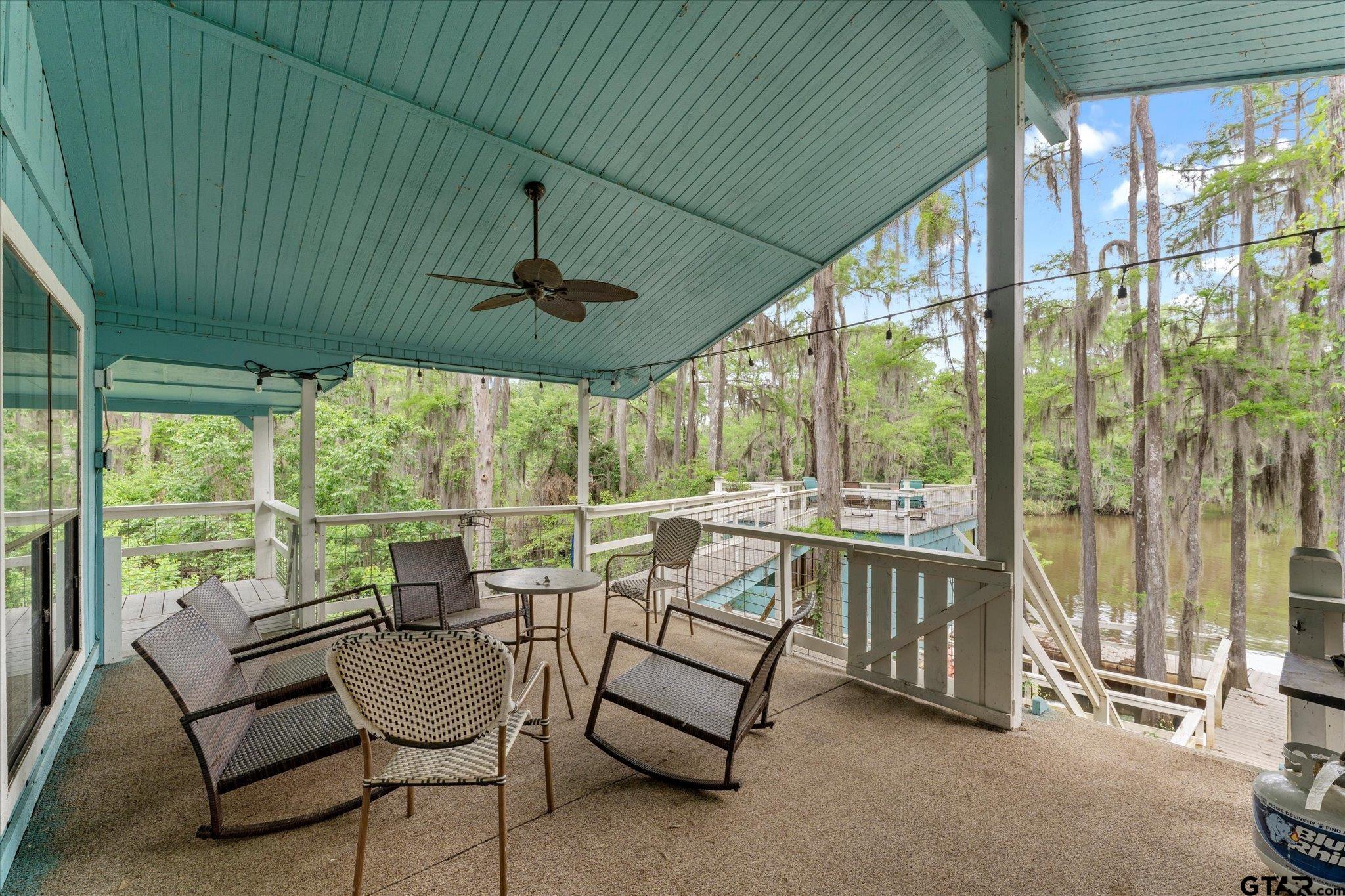 230 Sesame Street West Karnack, TX 75661 - Photo 17 of 44 a balcony with furniture and a potted plant