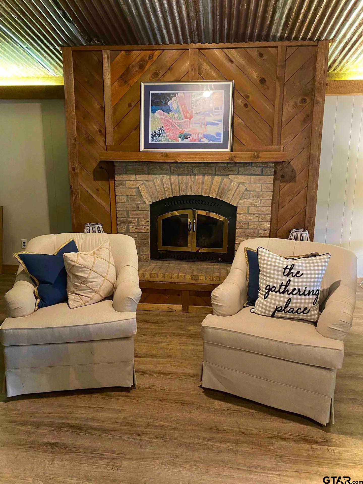 230 Sesame Street West Karnack, TX 75661 - Photo 34 of 44 a living room with furniture and a fireplace