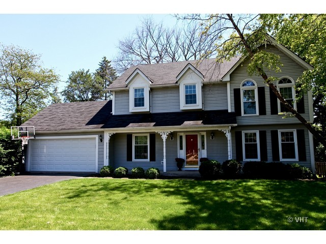 1933 Pine Road Lisle, IL 60532 - Photo 1 of 12 a front view of a house with a yard