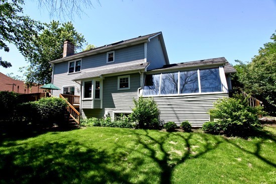 1933 Pine Road Lisle, IL 60532 - Photo 11 of 12 a view of a house with brick walls and a yard with plants
