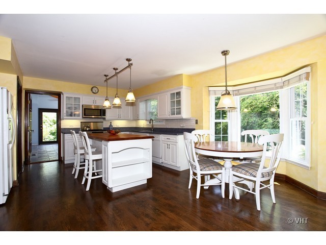 1933 Pine Road Lisle, IL 60532 - Photo 3 of 12 a dining room with furniture and wooden floor