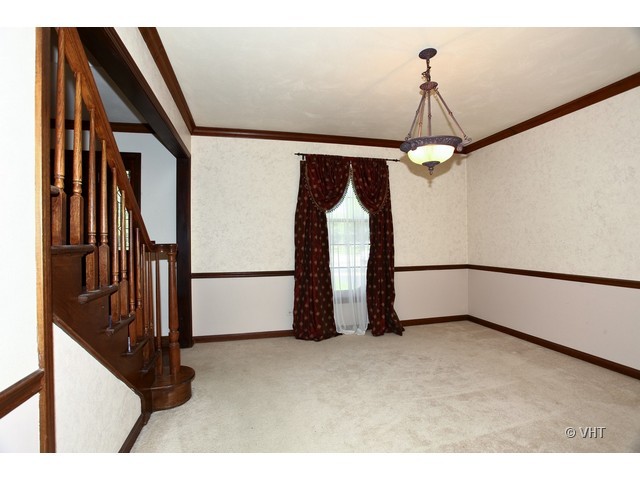 1933 Pine Road Lisle, IL 60532 - Photo 4 of 12 a view of an empty room with a window