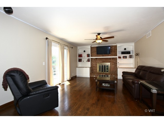 1933 Pine Road Lisle, IL 60532 - Photo 6 of 12 a living room with furniture and a flat screen tv