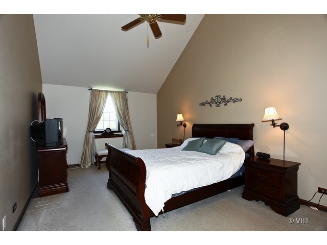 1933 Pine Road Lisle, IL 60532 - Photo 7 of 12 a bedroom with a bed and wooden floor