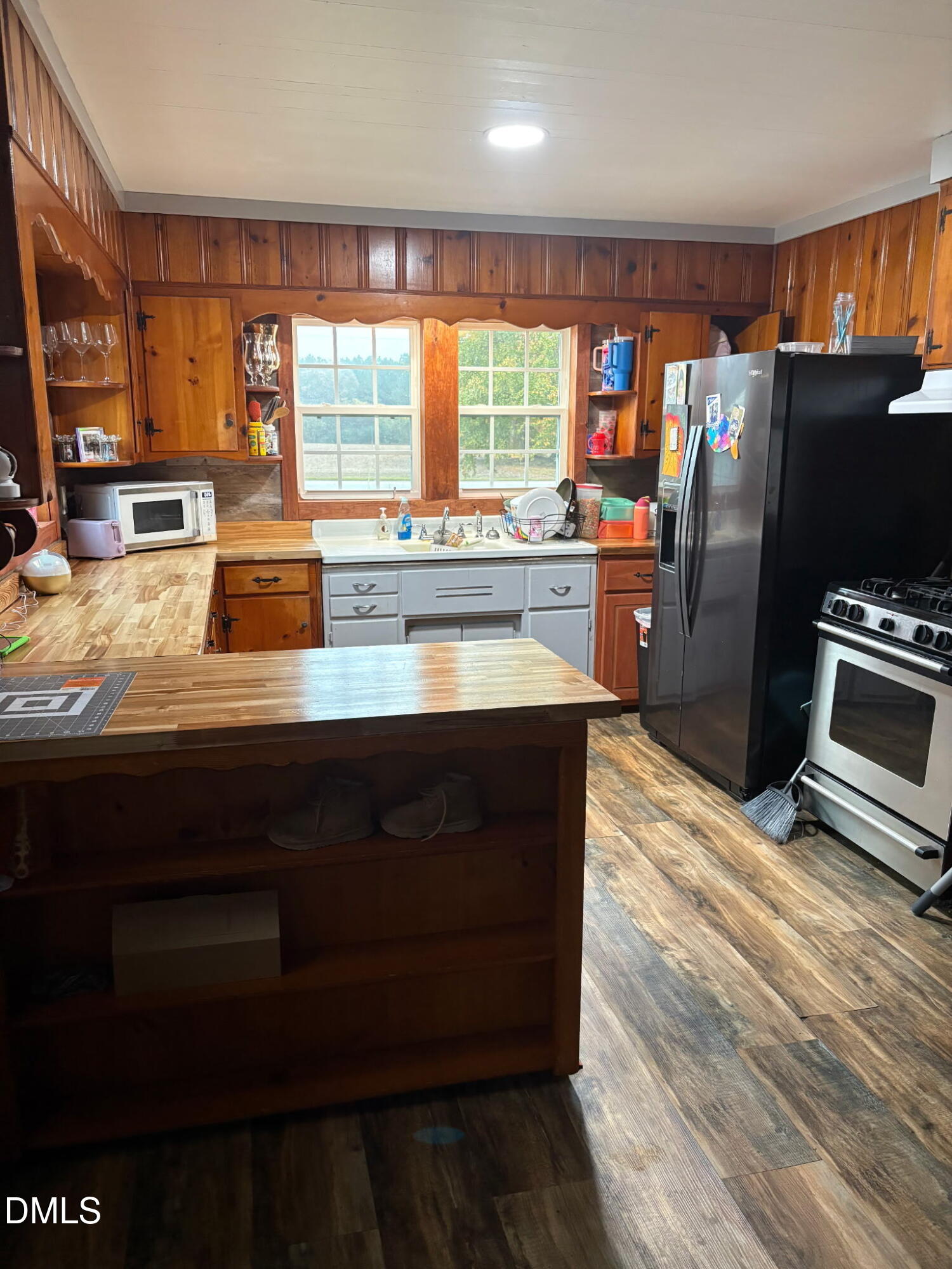 130 Fitzgerald Road Selma, NC 27576 - Photo 12 of 18 a kitchen with stainless steel appliances wooden cabinets a refrigerator and a stove