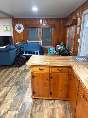 a view of gallery with wooden floor