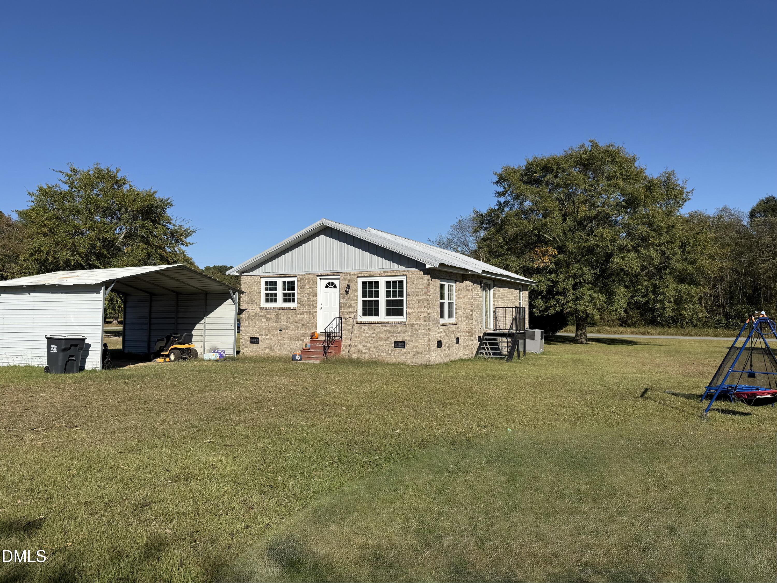 130 Fitzgerald Road Selma, NC 27576 - Photo 2 of 18 a front view of a house with a yard