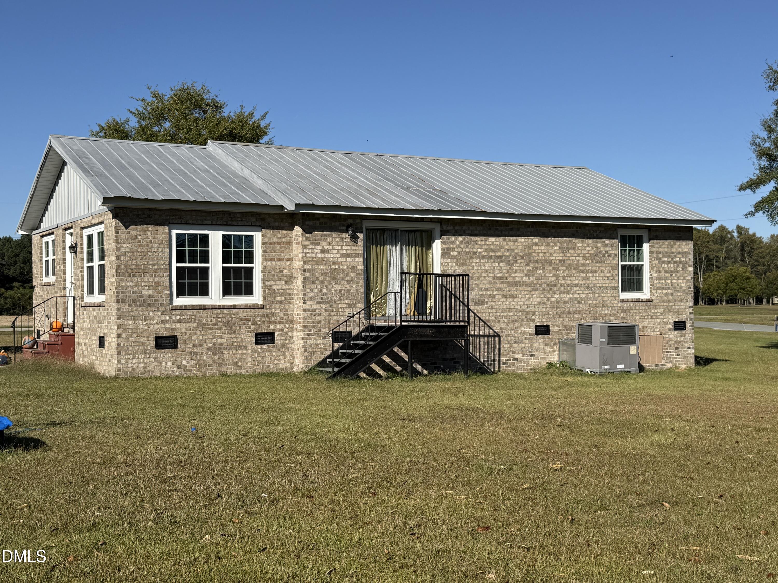 130 Fitzgerald Road Selma, NC 27576 - Photo 4 of 18 a view of a house with backyard