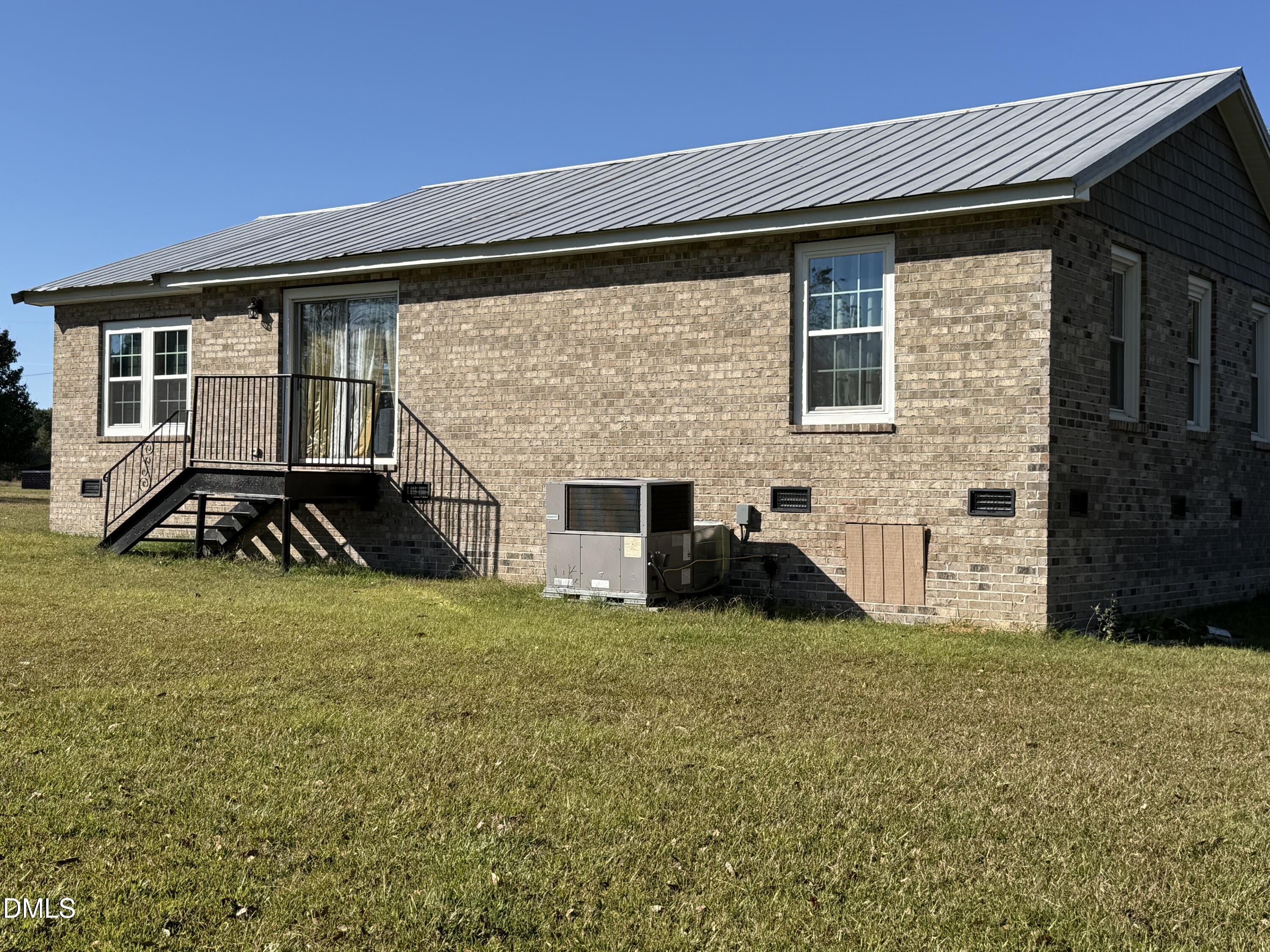 130 Fitzgerald Road Selma, NC 27576 - Photo 6 of 18 a view of a house with a yard