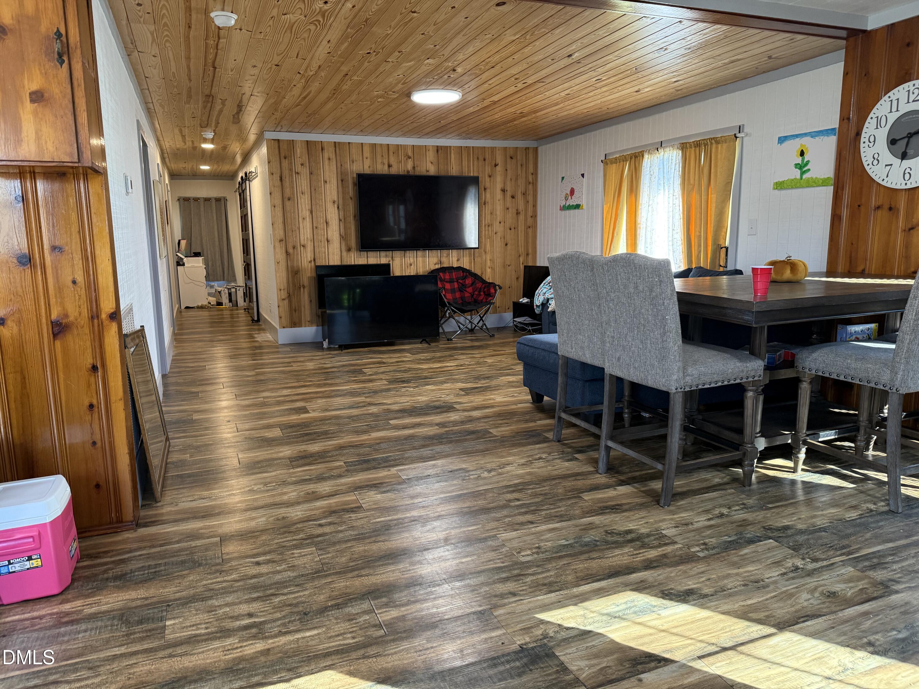 130 Fitzgerald Road Selma, NC 27576 - Photo 10 of 18 a living room with furniture a flat screen tv and a table