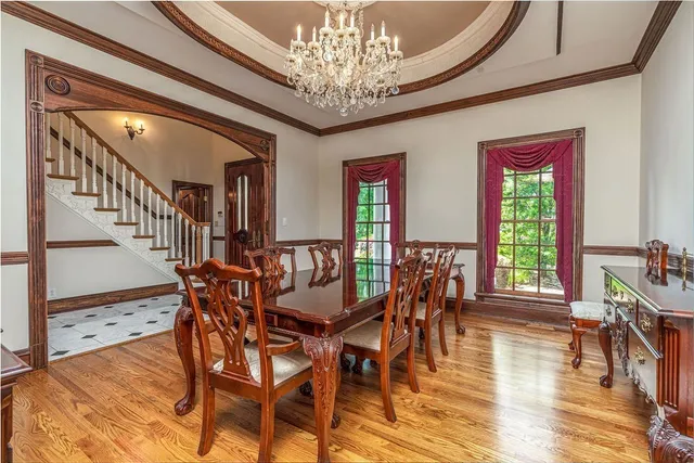 a kitchen with stainless steel appliances granite countertop a sink and a refrigerator