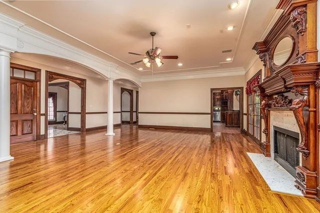a close view of a stove a microwave oven and next to a window