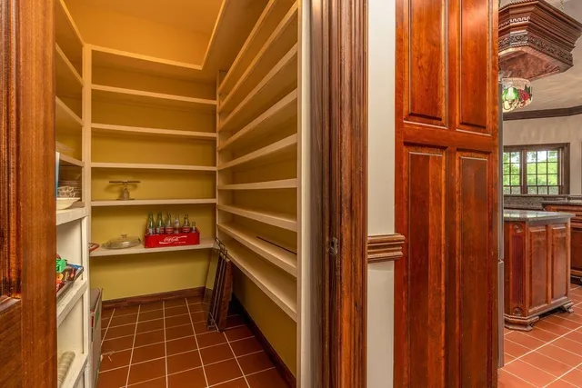 a view of walk in closet with wooden floor