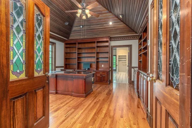 a bathroom with a sink a light fixture and a mirror