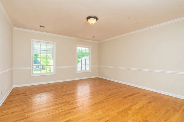 a view of a chair and table in the backyard
