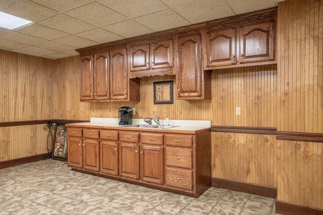 a view of a backyard with table and chairs and plants