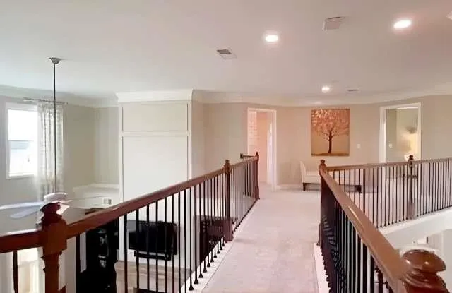 a view of a hallway with windows