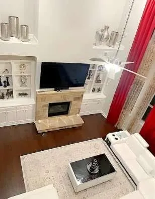 a living room with furniture and a flat screen tv