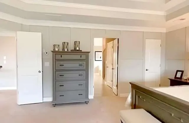 a kitchen with a refrigerator and cabinets