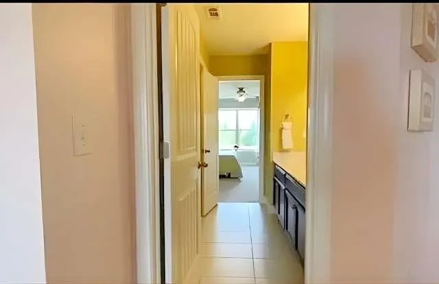 a en suite bathroom with a sink and a mirror