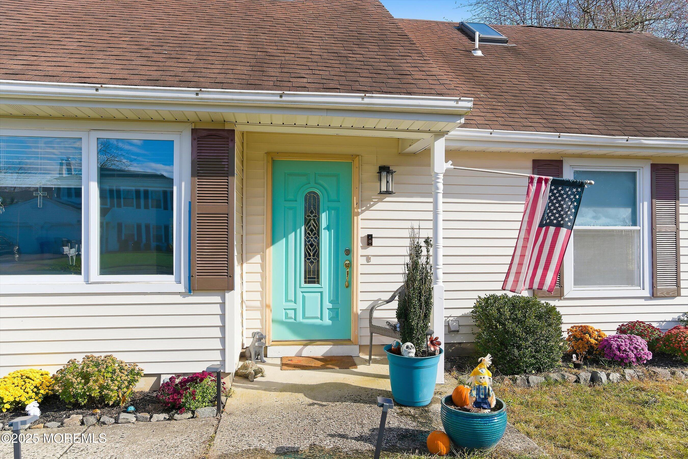 101 Reflection Road Toms River, NJ 08753 - Photo 3 of 28 a front view of a house with a potted plant