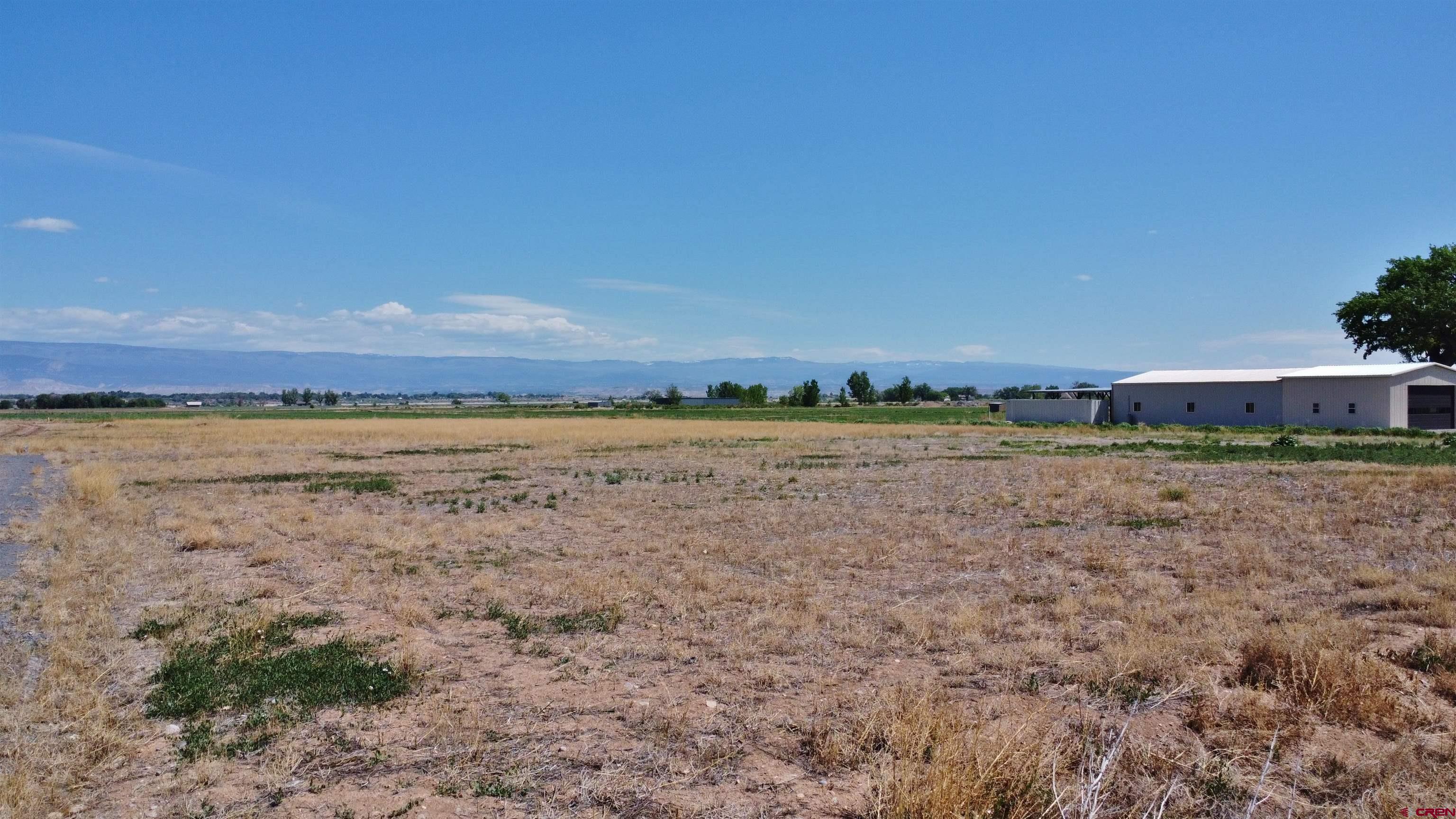 17185 B Road Delta, CO 81416 - Photo 2 of 9 a view of a field with ocean view