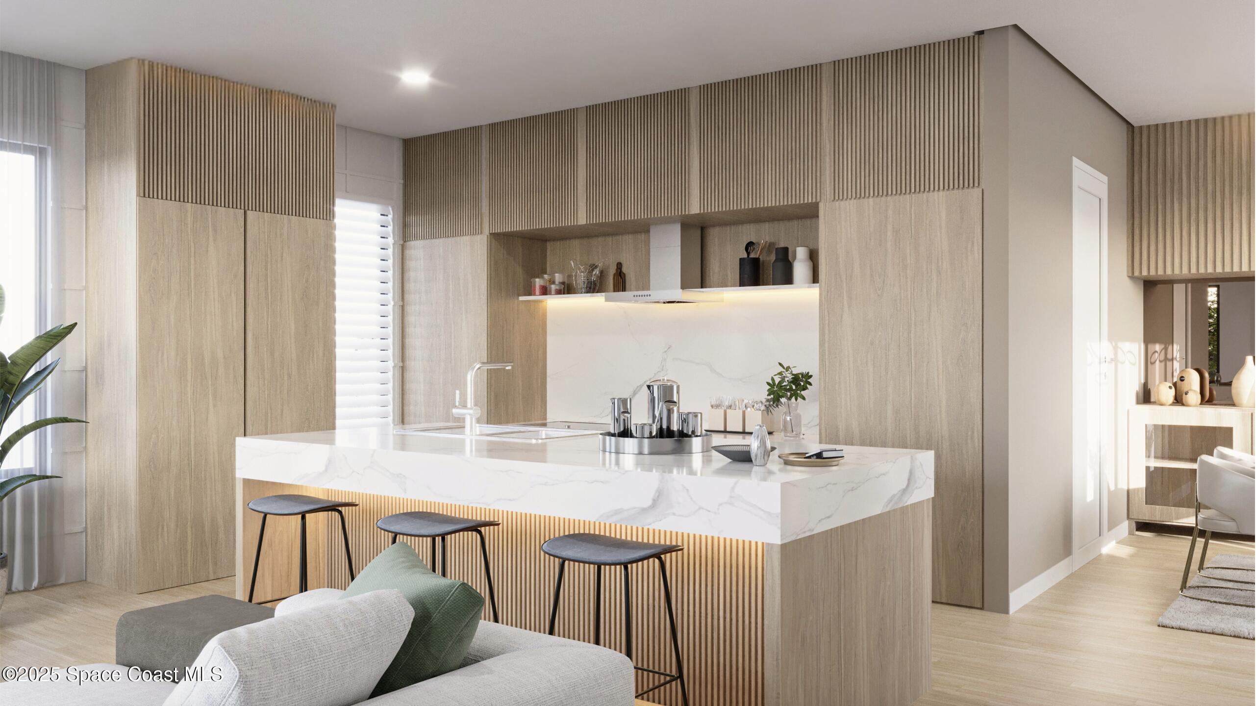 2282 Livnats Lane Melbourne, FL 32901 - Photo 3 of 20 a kitchen with stainless steel appliances kitchen island granite countertop a sink and cabinets