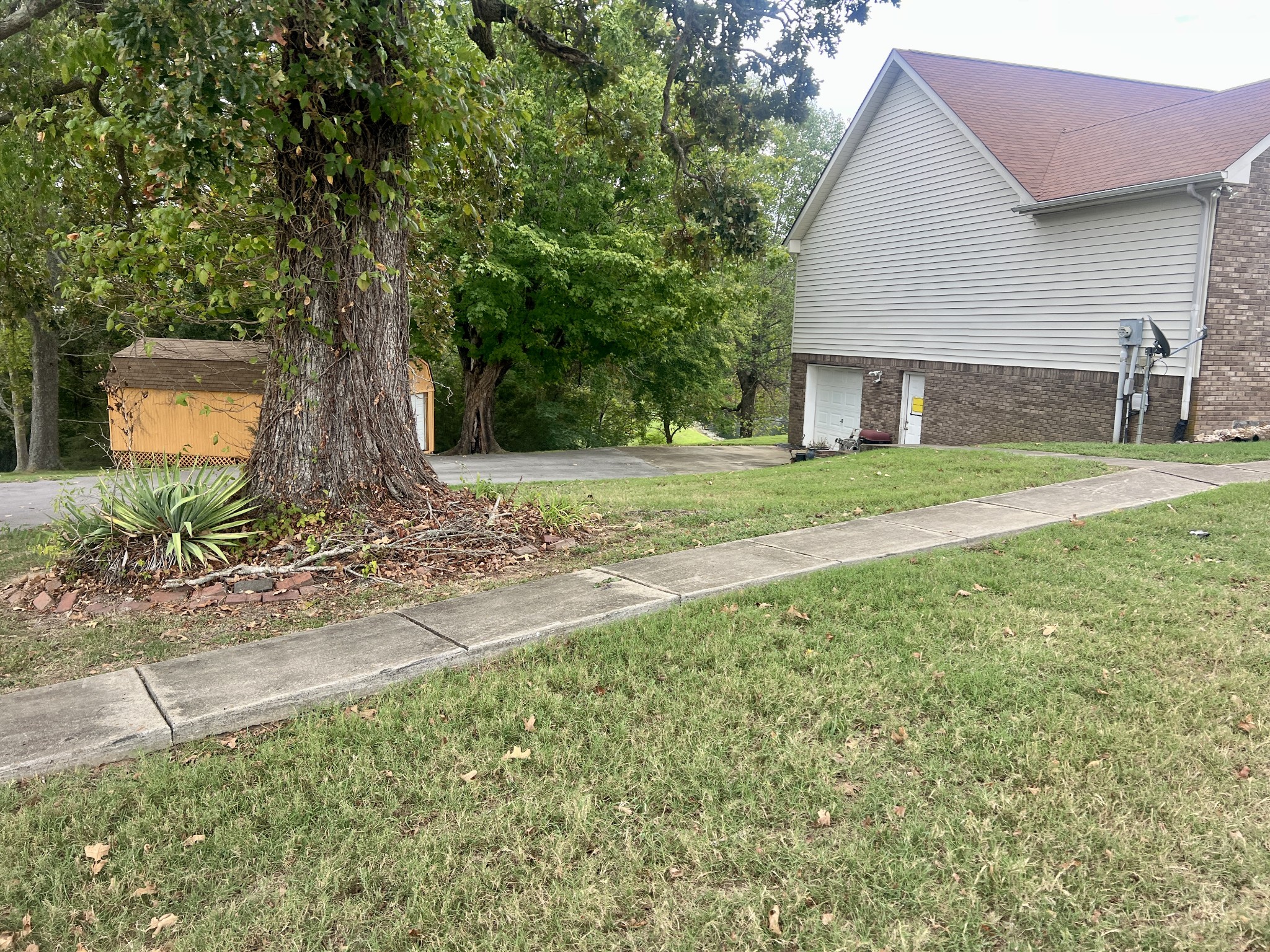 4207 Station Road Cunningham, TN 37052 - Photo 33 of 36 a front view of a house with a yard and garage