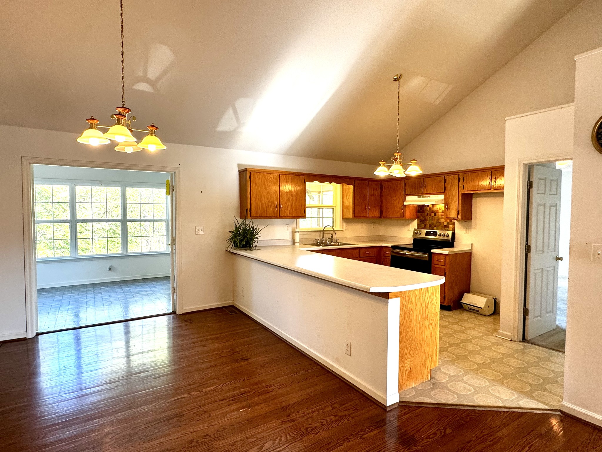 4207 Station Road Cunningham, TN 37052 - Photo 5 of 36 a kitchen with stainless steel appliances kitchen island granite countertop a stove a sink and a refrigerator