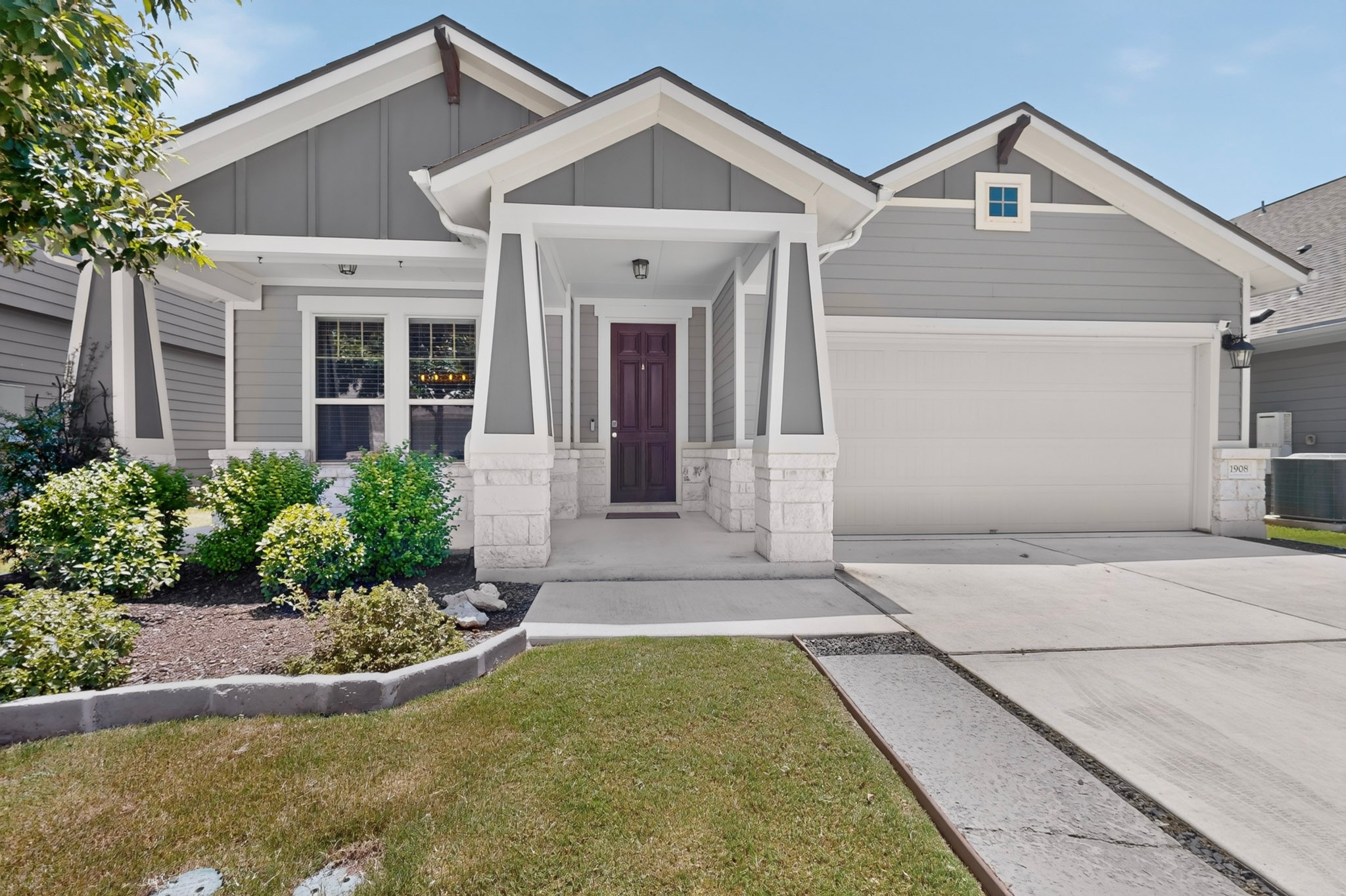 1908 Turtle Bay Loop Leander, TX 78641 - Photo 1 of 38 A welcoming front facade showcases a rich wooden door, well-maintained landscaping, and a convenient attached garage.