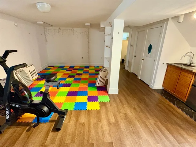 a room that has a bed and a dresser in it