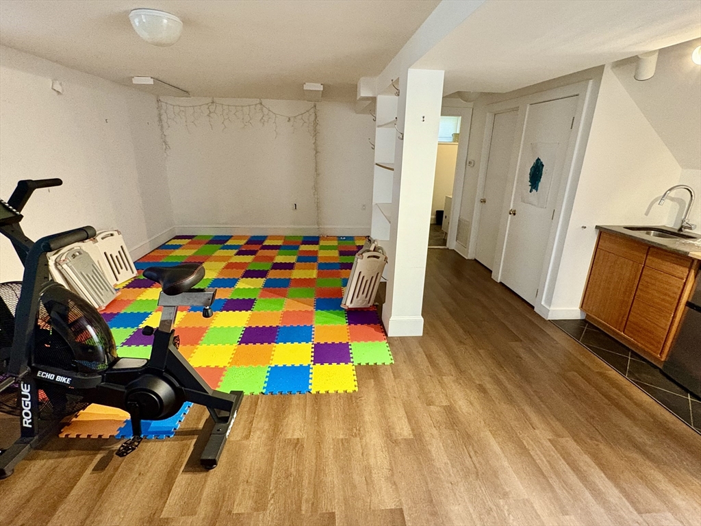 7 Standish Street, Unit 7 Cambridge, MA 02138 - Photo 13 of 16 a room that has a bed and a dresser in it