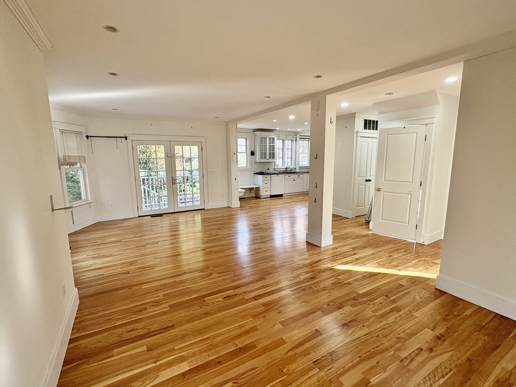 7 Standish Street, Unit 7 Cambridge, MA 02138 - Photo 2 of 16 a view of an empty room with window and wooden floor
