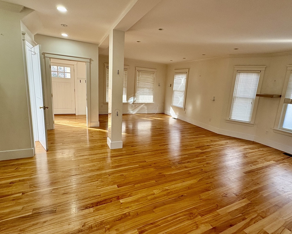 7 Standish Street, Unit 7 Cambridge, MA 02138 - Photo 3 of 16 a view of empty room with wooden floor and seating space