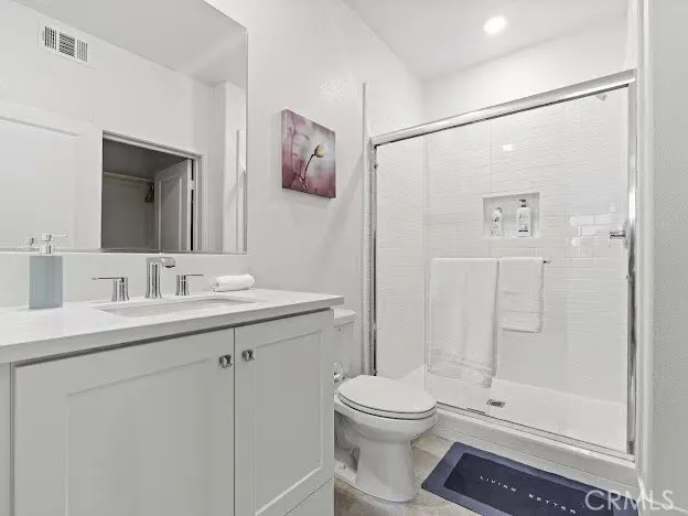 a bathroom with a toilet sink a shower and