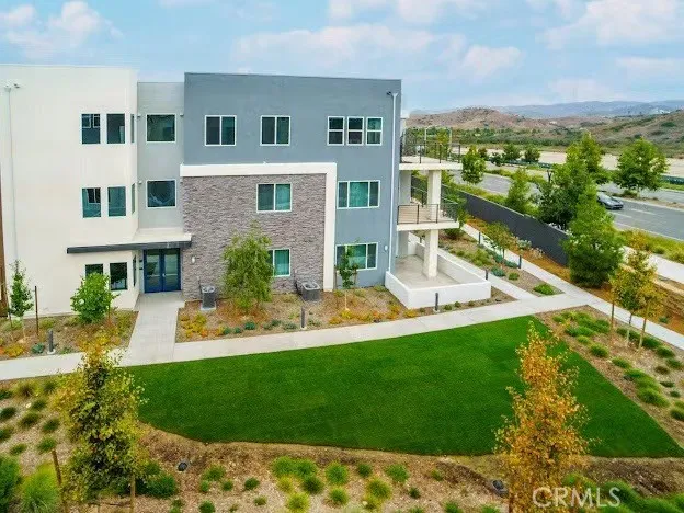 a bedroom with a large bed and a large window