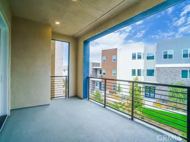 a view of front door with a balcony