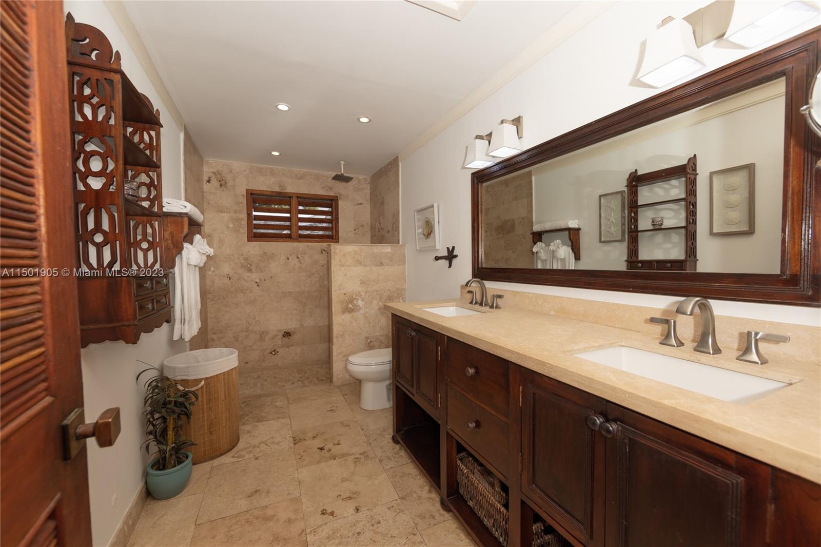 0 Country Club Drive undefined, FL 00000 - Photo 35 of 76 a spacious bathroom with a double vanity sink toilet and a shower
