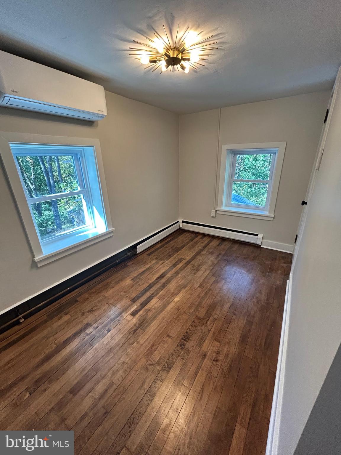 1355 Penn Grant Road, Unit 1 Strasburg, PA 17579 - Photo 7 of 14 a view of room with window and wooden floor