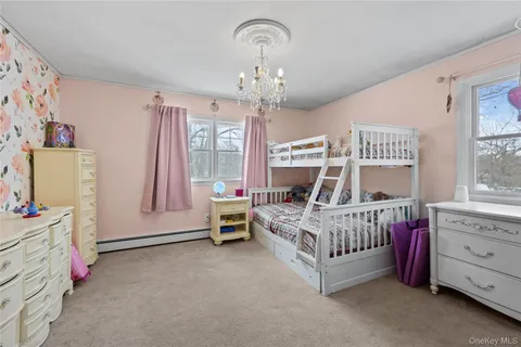 a view of a hallway with a painting on the wall