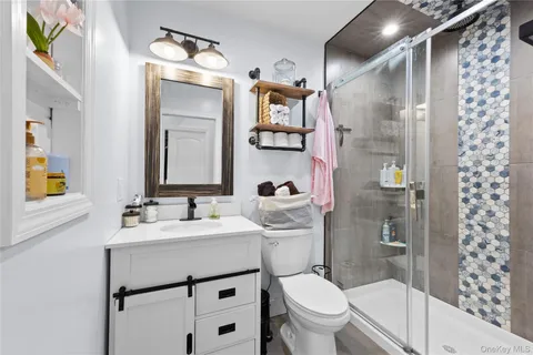 a bedroom with a bed and flat screen tv