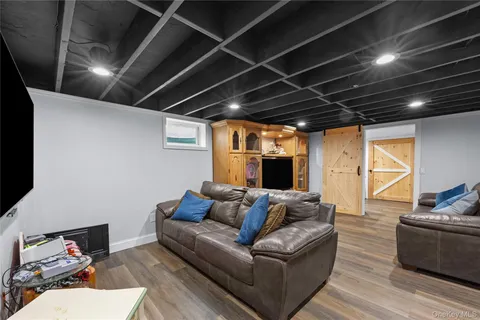 a view of a house with snow on the road