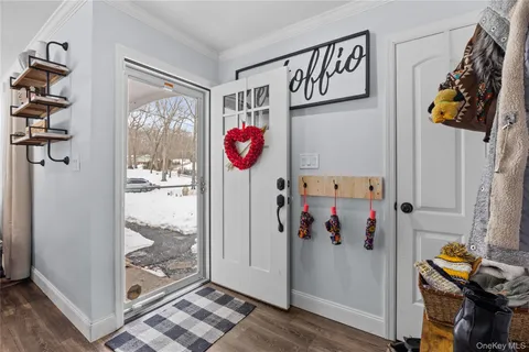 front view of a house with a wooden fence